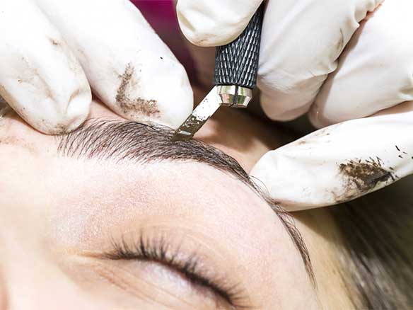 microblading knife in hand