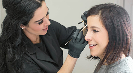 lady applying cosmetics