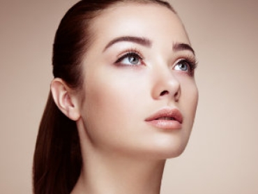 young attractive woman with big blue eyes looks up