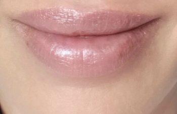 Close-up of a person's lips with a smooth, even appearance and the word "Healed" written above them.