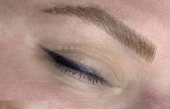 A close-up of a closed eye with defined eyebrow and black eyeliner. An inset shows the same eye before makeup, with lighter, less defined eyebrow and no eyeliner.