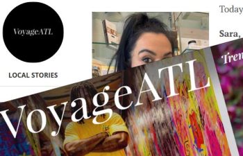Screenshot shows the VoyageATL website featuring a black circular logo, "Local Stories" text, and partially visible photos of people and colorful backgrounds.